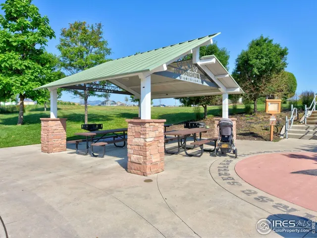 an outdoor space with furniture and garden