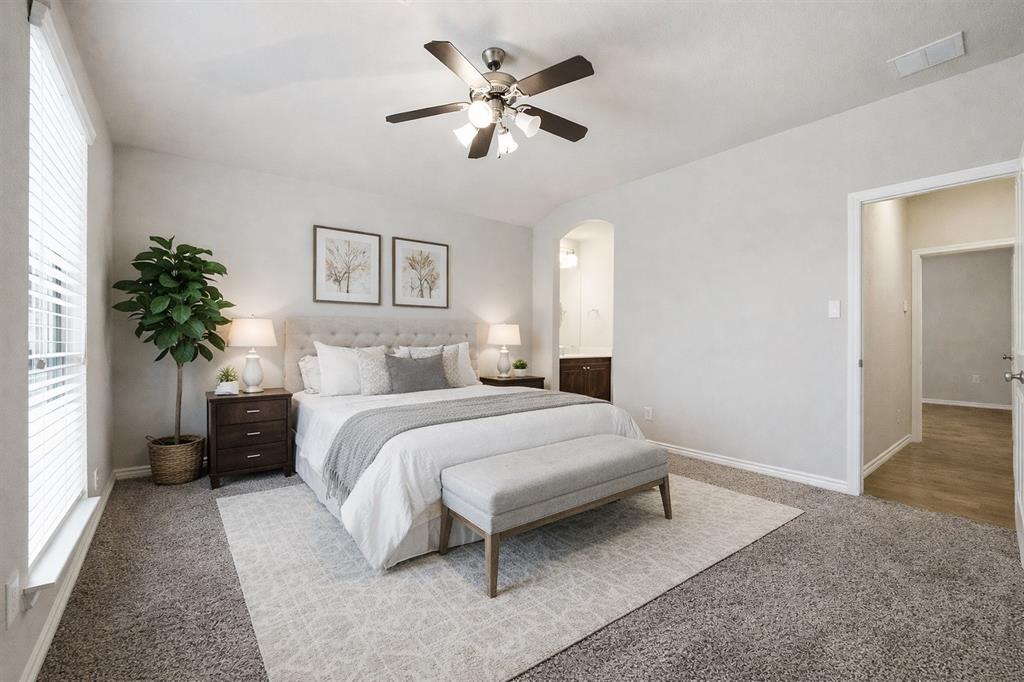 420 Prairie Run Aledo, TX 76008 - Photo 27 of 38 a spacious bedroom with a bed and a chandelier