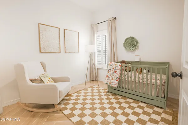 a bedroom with a couch and a table