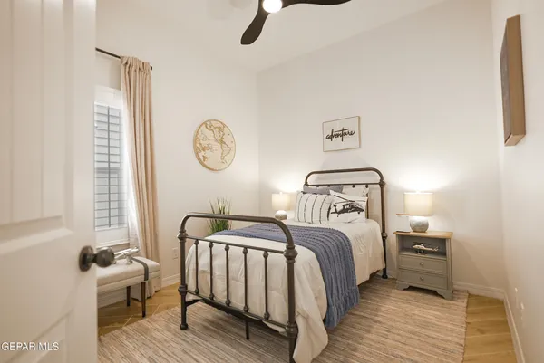 a bedroom with a bed and a window