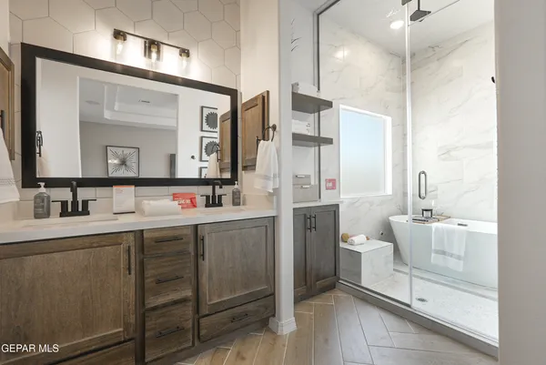 a bathroom with a double vanity sink mirror and toilet