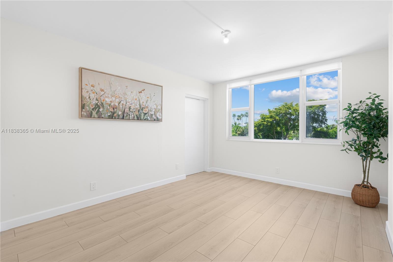 4400 Hillcrest Drive, Unit 314B Hollywood, FL 33021 - Photo 12 of 25 an empty room with potted plant and windows