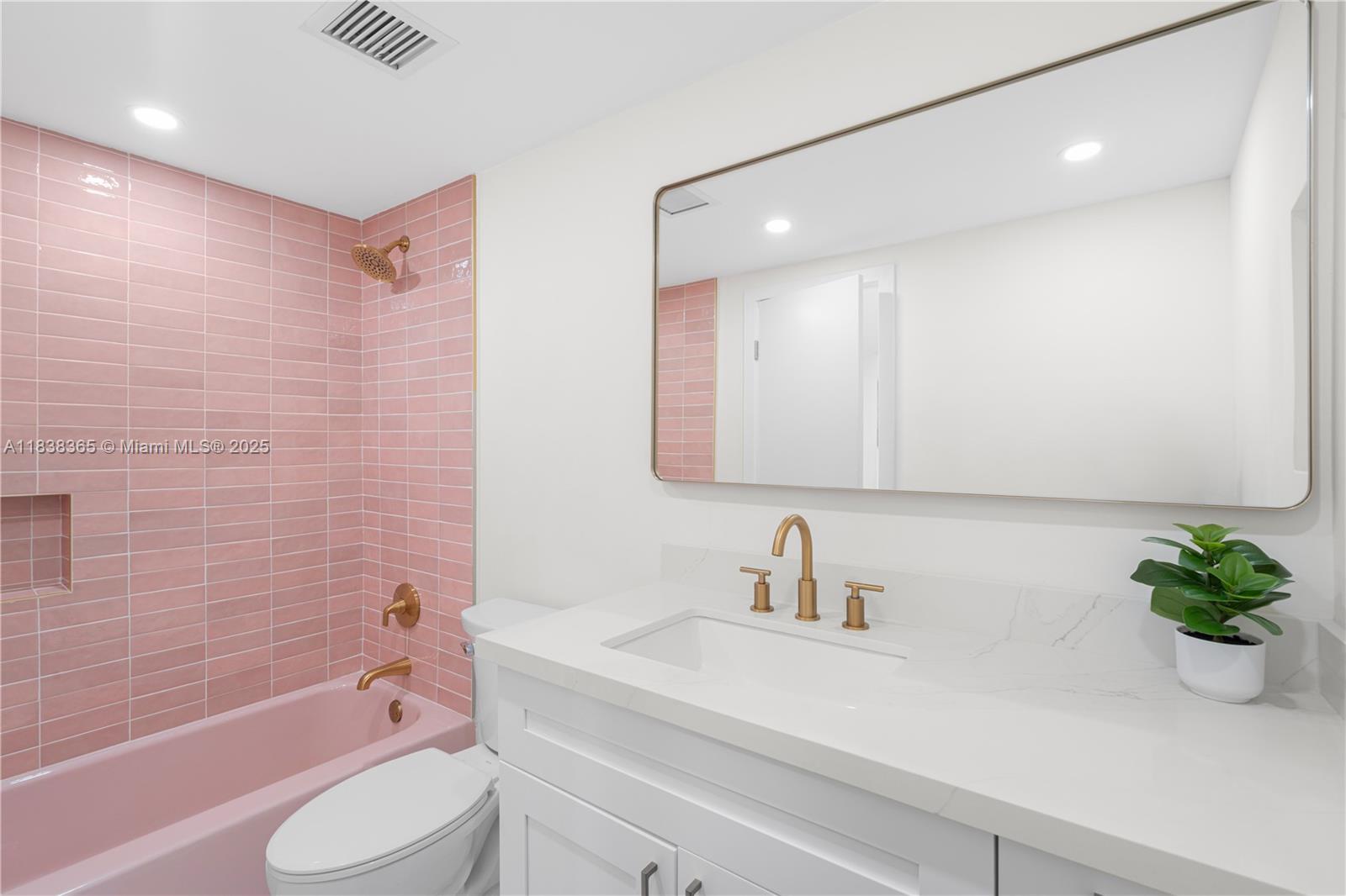 4400 Hillcrest Drive, Unit 314B Hollywood, FL 33021 - Photo 14 of 25 a bathroom with a sink a toilet a tub and shower