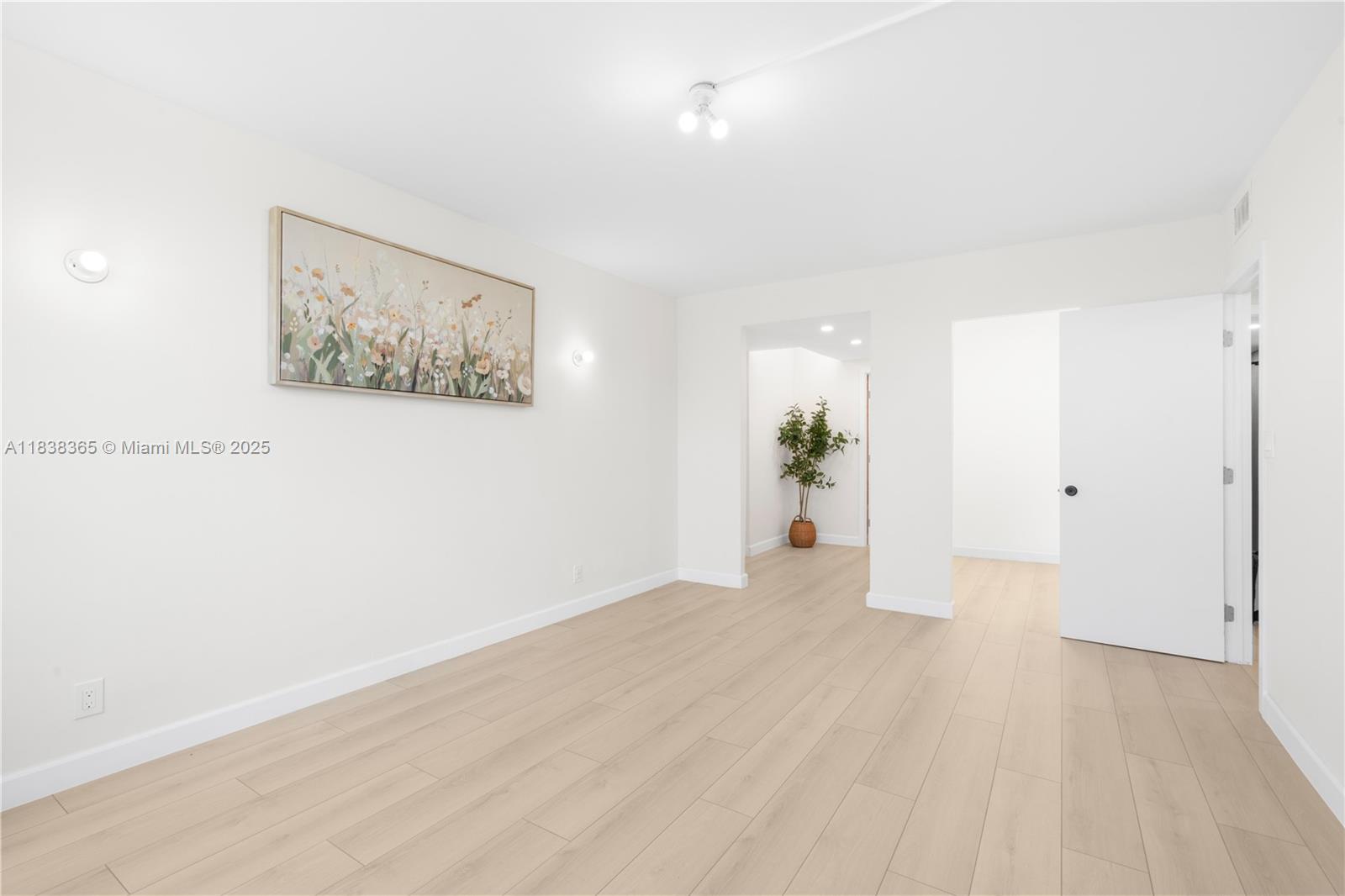 4400 Hillcrest Drive, Unit 314B Hollywood, FL 33021 - Photo 20 of 25 a view of a big room with wooden floor and potted plant