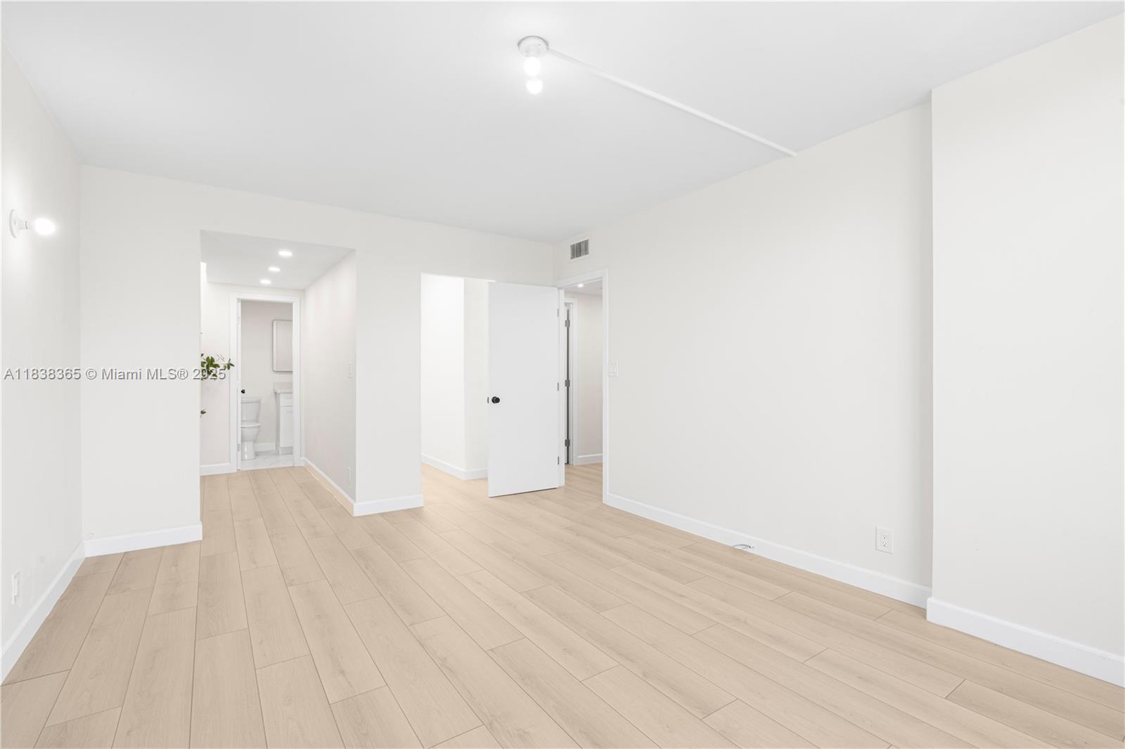 4400 Hillcrest Drive, Unit 314B Hollywood, FL 33021 - Photo 21 of 25 a view of a big room with wooden floor and a bathroom