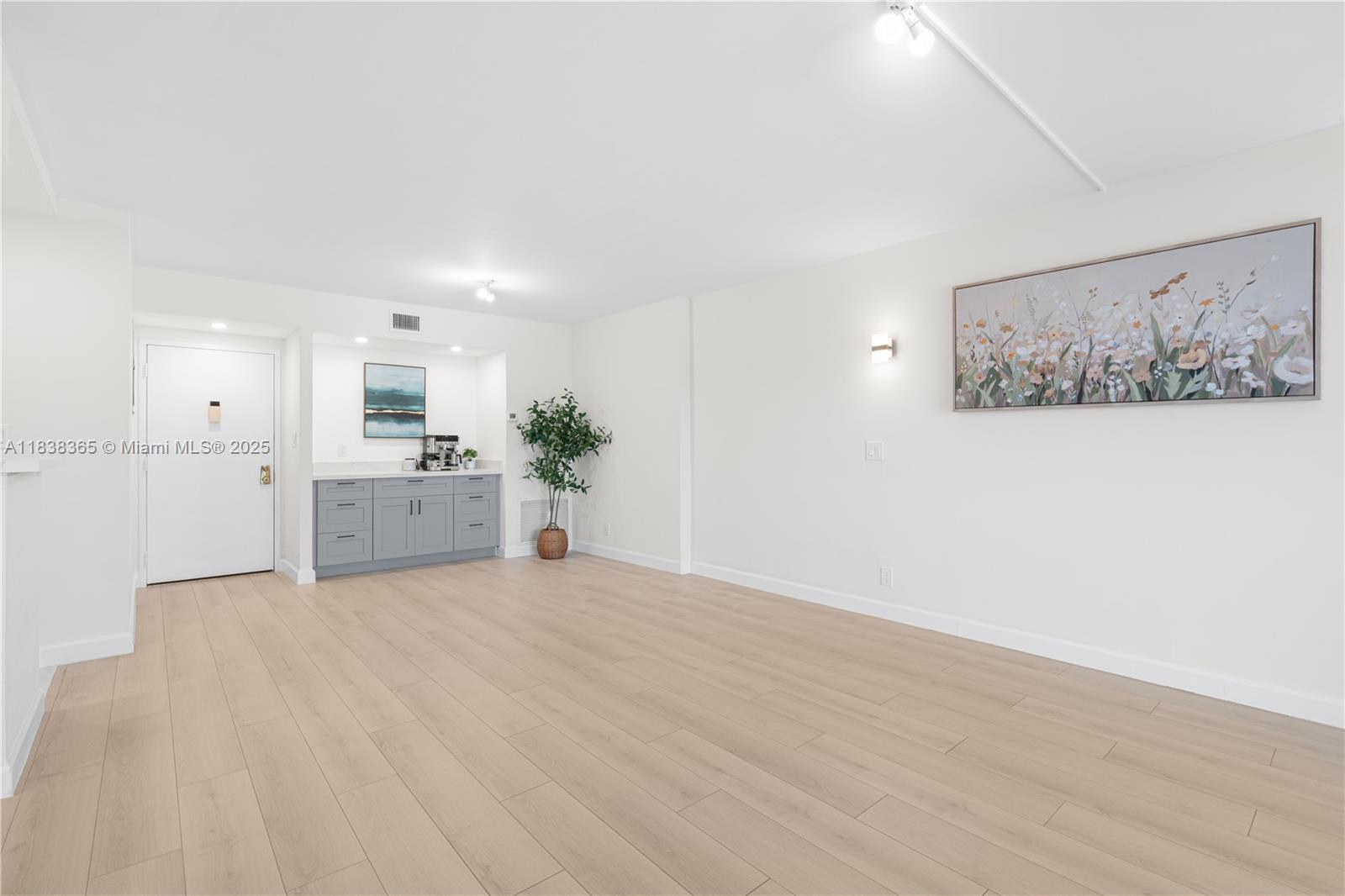4400 Hillcrest Drive, Unit 314B Hollywood, FL 33021 - Photo 6 of 25 a view of a kitchen with microwave and cabinets