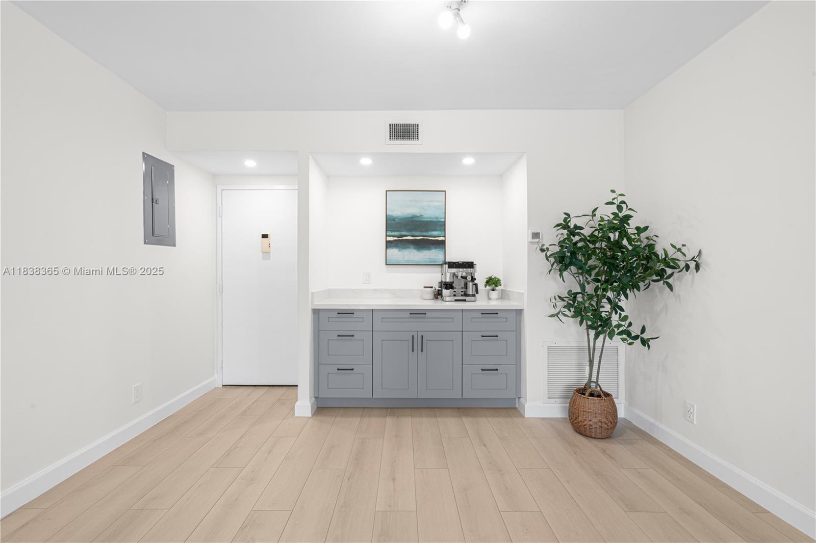 4400 Hillcrest Drive, Unit 314B Hollywood, FL 33021 - Photo 8 of 25 a bathroom with a sink a faucet a potted plant and a mirror