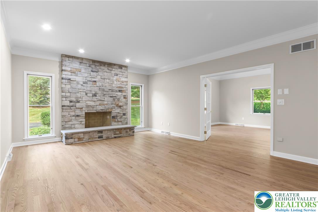 3685 Manor Road Bethlehem, PA 18020 - Photo 16 of 47 an empty room with windows and fireplace