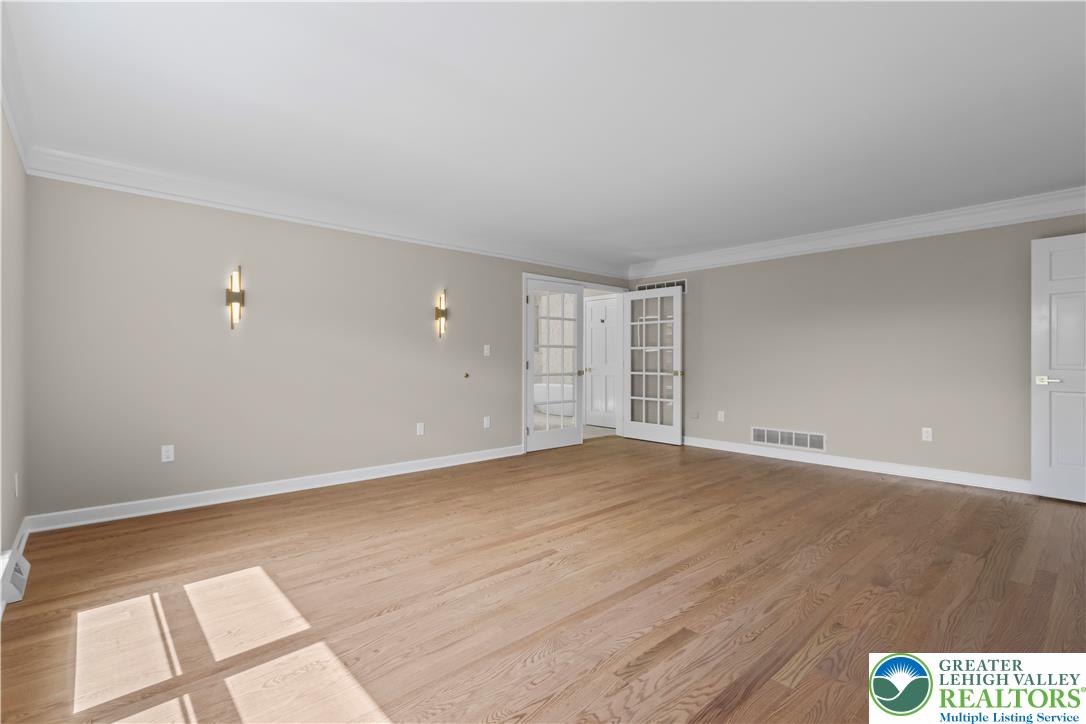 3685 Manor Road Bethlehem, PA 18020 - Photo 22 of 47 a view of an empty room with wooden floor and a window