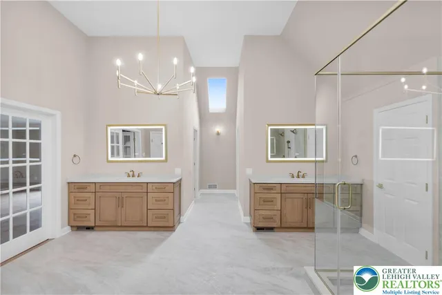 a view of a kitchen with cabinets and wooden floor