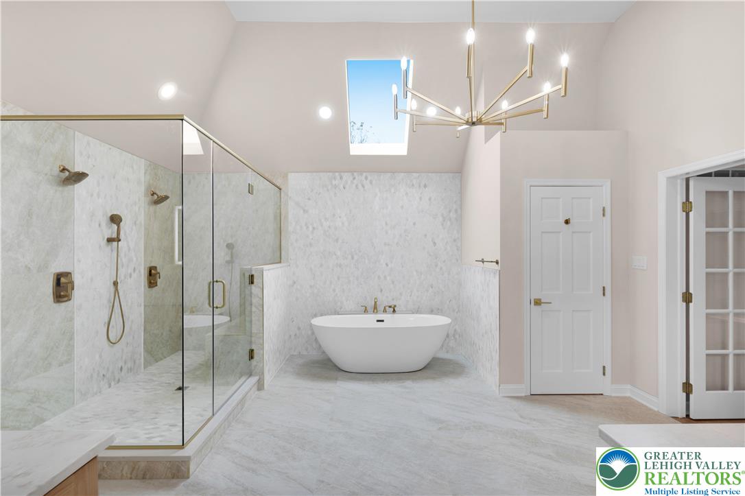 3685 Manor Road Bethlehem, PA 18020 - Photo 25 of 47 a spacious bathroom with a shower a sink and mirror