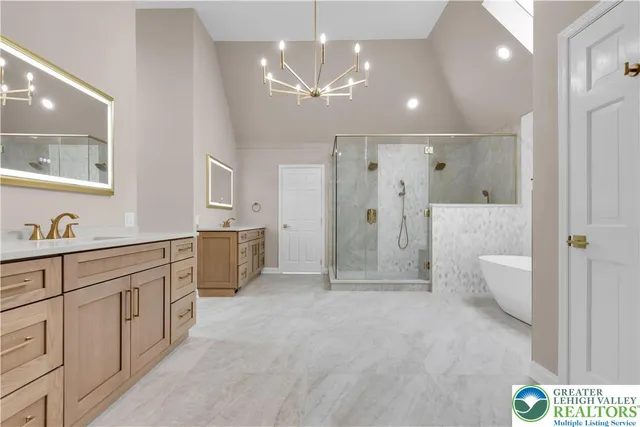 a bathroom with a double vanity sink a toilet a mirror and shower