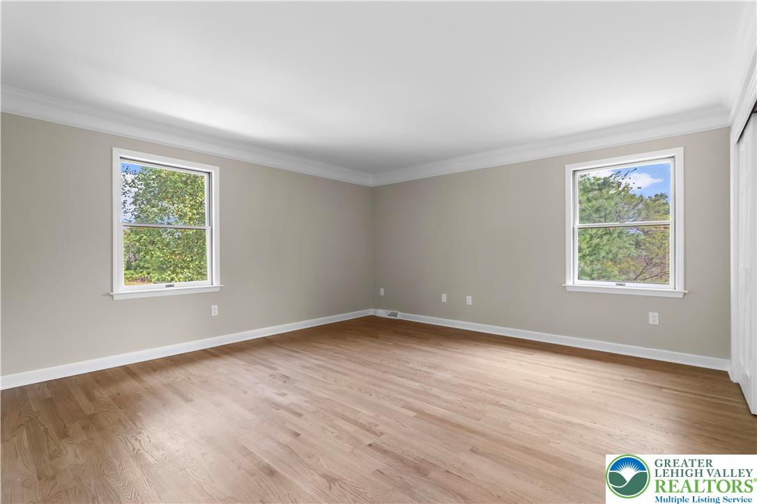 3685 Manor Road Bethlehem, PA 18020 - Photo 29 of 47 an empty room with wooden floor and windows