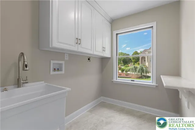 a bathroom with a sink and cabinets