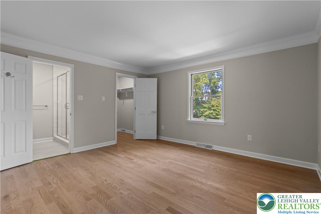 3685 Manor Road Bethlehem, PA 18020 - Photo 40 of 47 a view of an empty room with wooden floor and a window