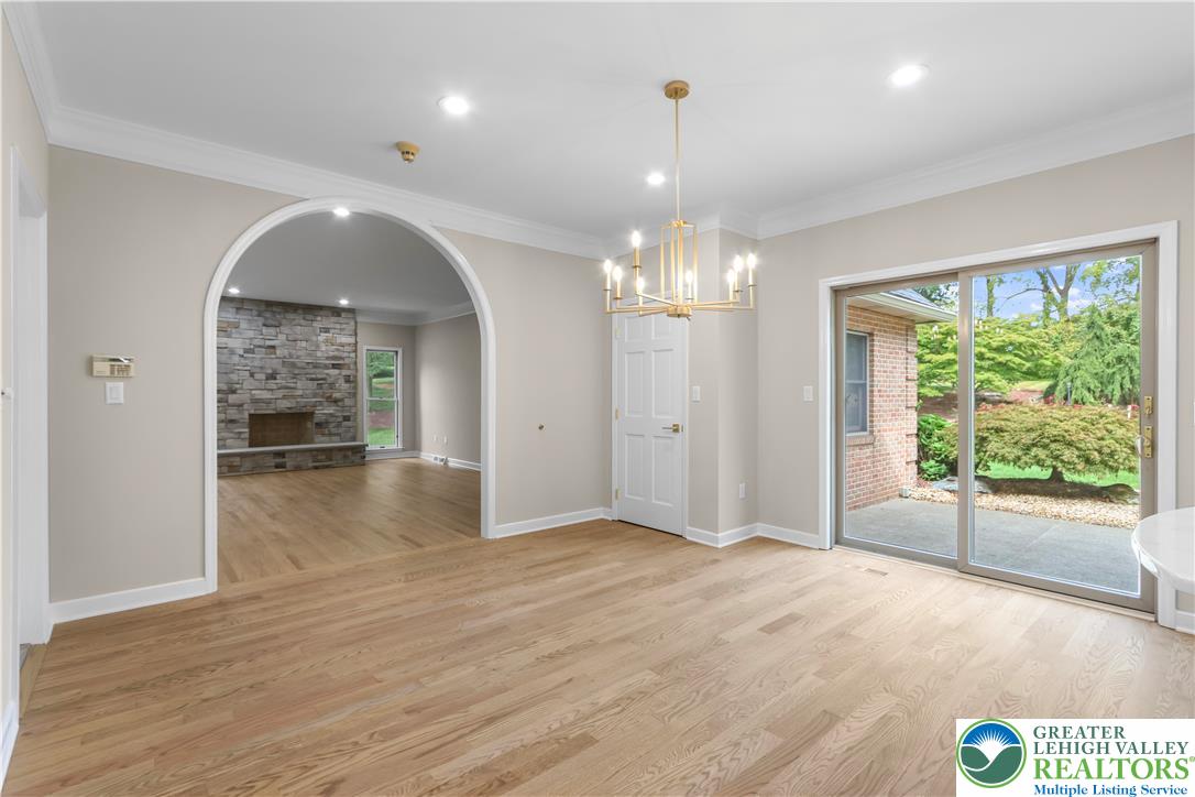 3685 Manor Road Bethlehem, PA 18020 - Photo 7 of 47 a view of a hallway with wooden floor and chandelier