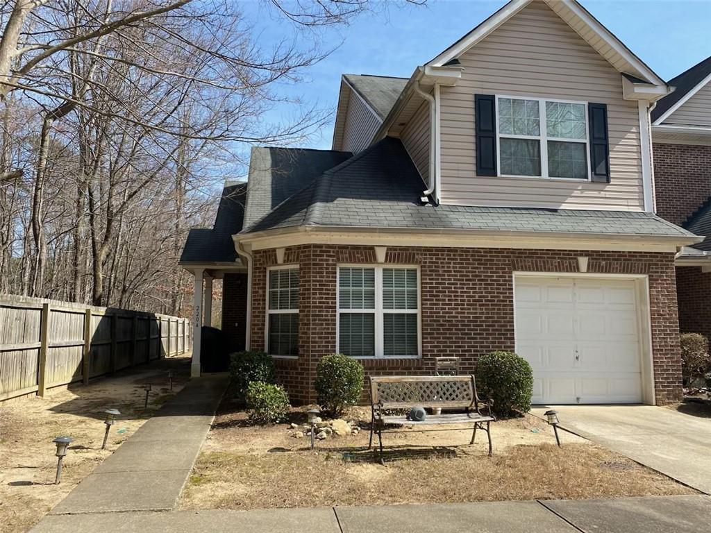 2555 Flat Shoals Road, Unit 2204 Atlanta, GA 30349 - Photo 1 of 1 View of front of property with a garage