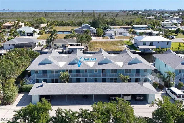 a view of a city that has lawn chairs and a potted plant
