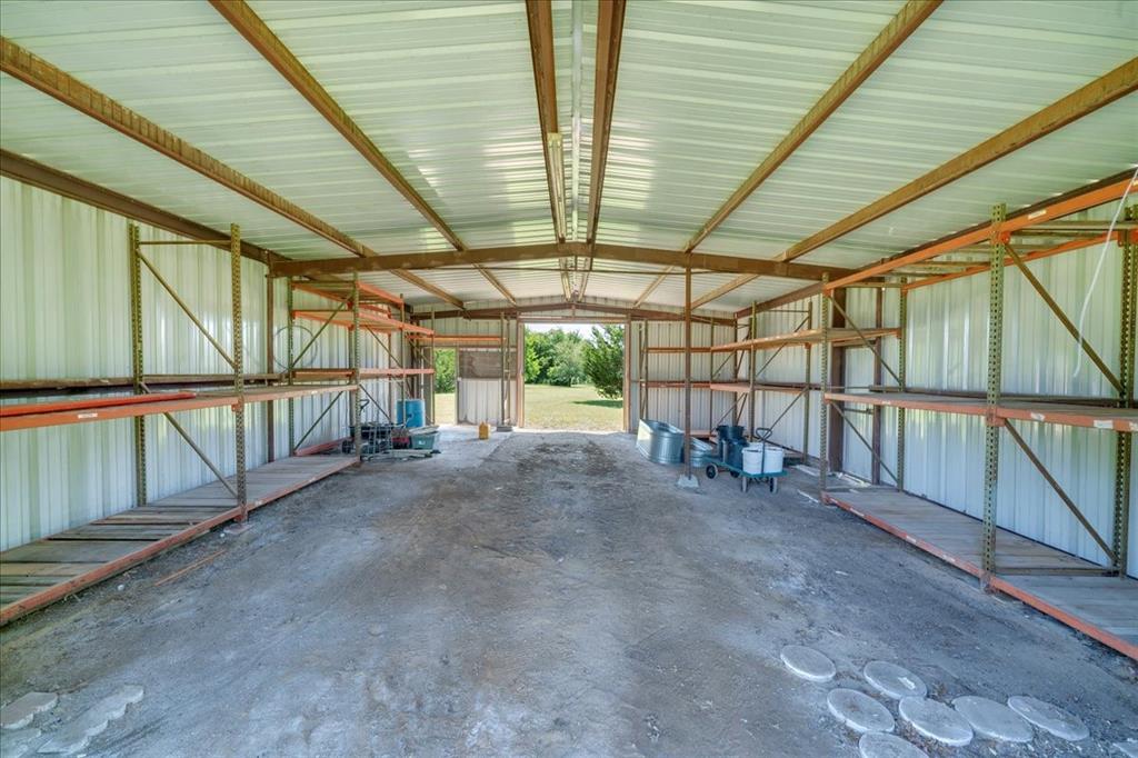 1900 South Duncanville Road Red Oak, TX 75154 - Photo 34 of 39 View of the inside of the barn; so much potential for whatever you need! The shelving will stay.