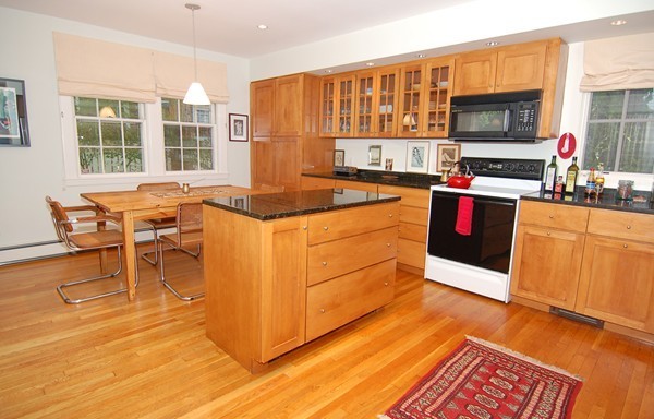 9 Camden Place Cambridge, MA 02138 - Photo 1 of 16 a kitchen with stainless steel appliances granite countertop a stove and a wooden cabinets