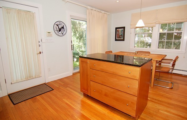 9 Camden Place Cambridge, MA 02138 - Photo 2 of 16 a bedroom with a bed and a window