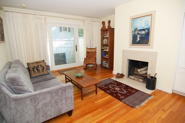 9 Camden Place Cambridge, MA 02138 - Photo 4 of 16 a living room with furniture a rug and a fireplace