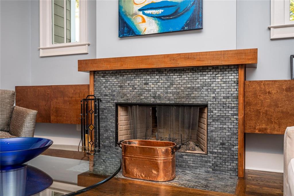 123 Ansley Street Decatur, GA 30030 - Photo 8 of 61 a fireplace sitting on top of a wooden floor