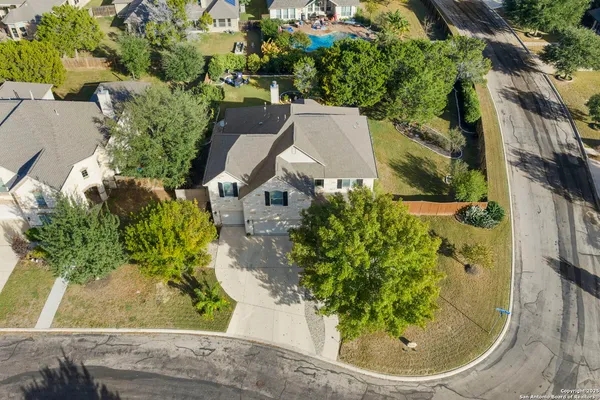a view of a playground with a tree