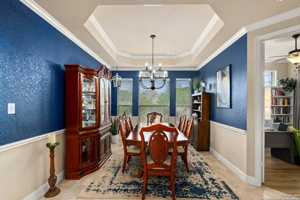 a kitchen with stainless steel appliances granite countertop wooden cabinets and a sink