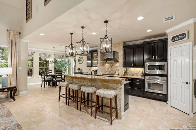 a spacious bathroom with a granite countertop sink a mirror a bathtub and a shower