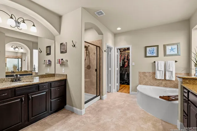 a bedroom with a bed and a view of bathroom