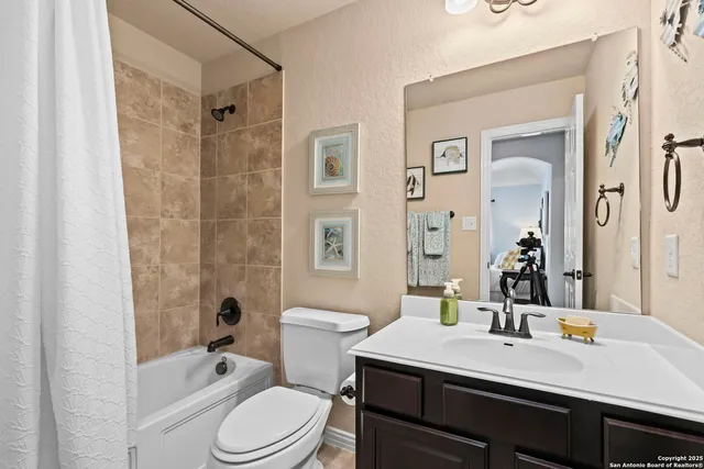 a view of a patio with a table and chairs