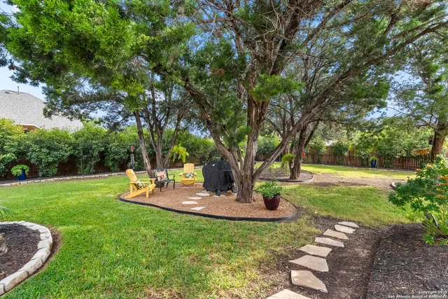 an aerial view of house with yard swimming pool and outdoor seating