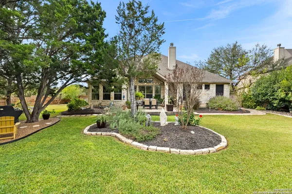 an aerial view of house with yard swimming pool and outdoor seating