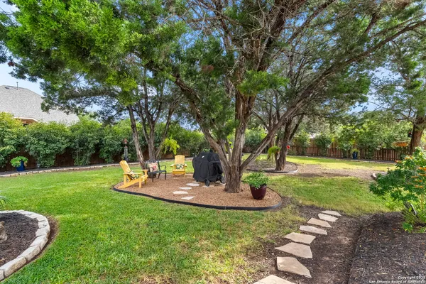 an aerial view of a house with a yard basket ball court and outdoor seating