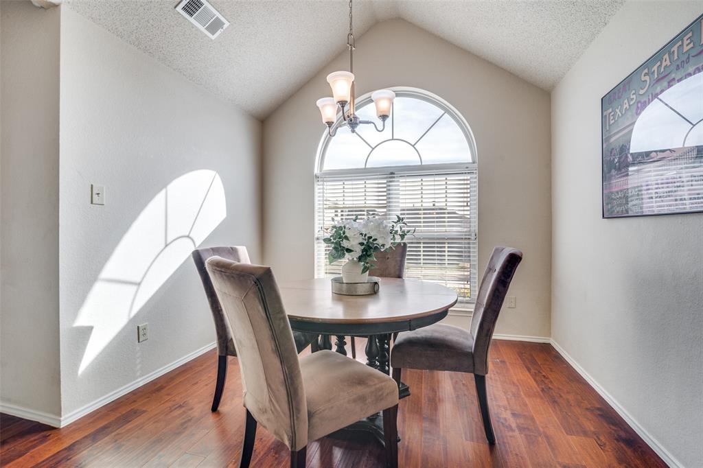 4201 Crystal Lane Garland, TX 75043 - Photo 11 of 33 a view of a dining room with furniture window and wooden floor