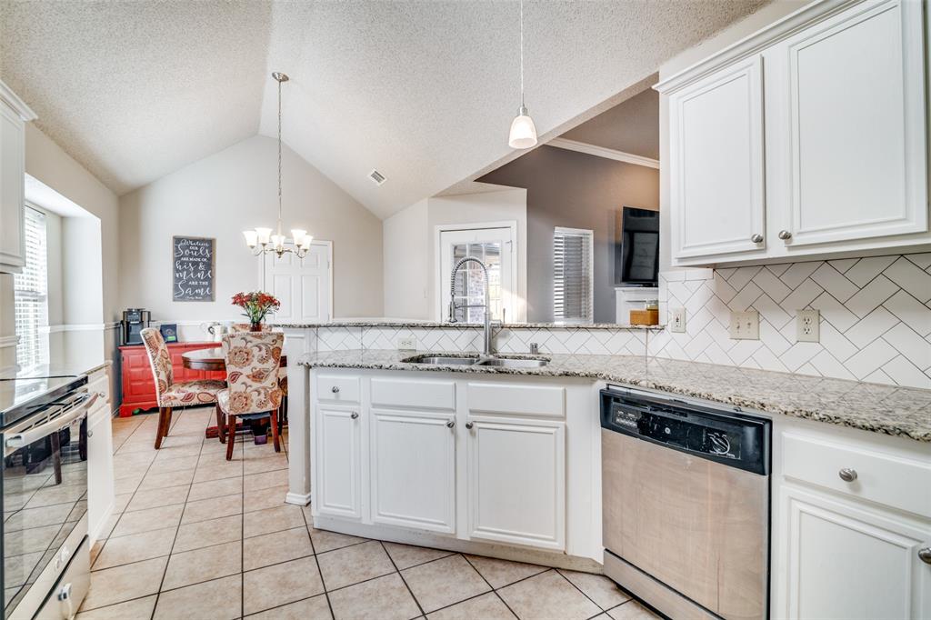 4201 Crystal Lane Garland, TX 75043 - Photo 13 of 33 a kitchen with a sink and cabinets