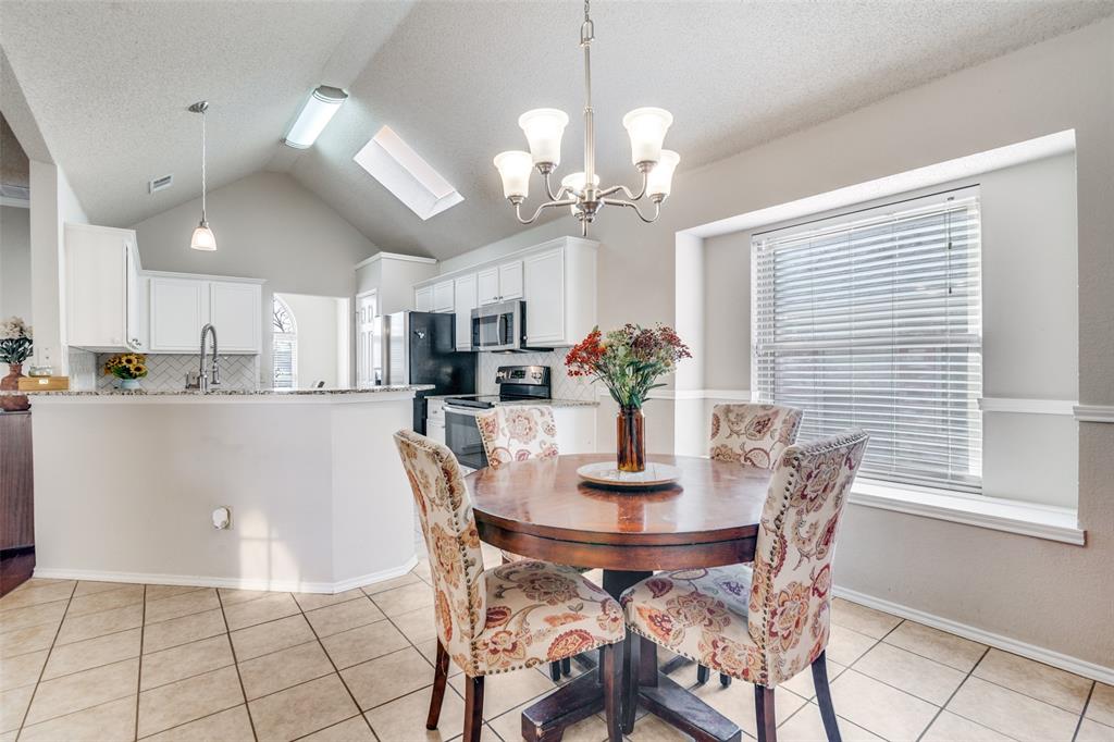 4201 Crystal Lane Garland, TX 75043 - Photo 16 of 33 a view of a dining room with furniture and chandelier