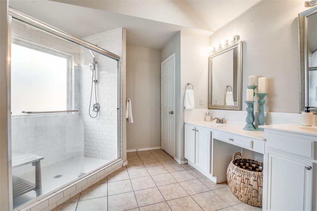 4201 Crystal Lane Garland, TX 75043 - Photo 20 of 33 a spacious bathroom with a shower sink and mirror