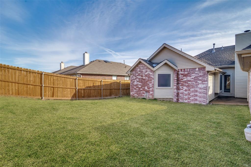 4201 Crystal Lane Garland, TX 75043 - Photo 31 of 33 a front view of a house with a garden