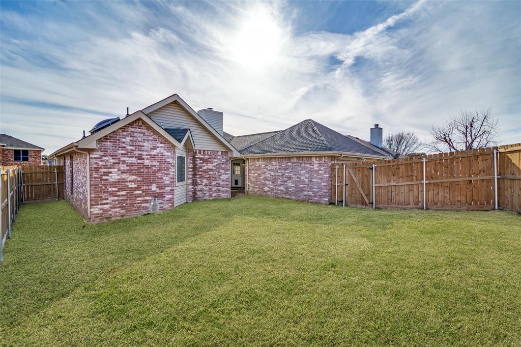 4201 Crystal Lane Garland, TX 75043 - Photo 32 of 33 a view of a backyard with a garden and entertaining space