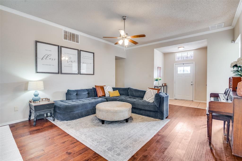 4201 Crystal Lane Garland, TX 75043 - Photo 8 of 33 a living room with furniture and a wooden floor