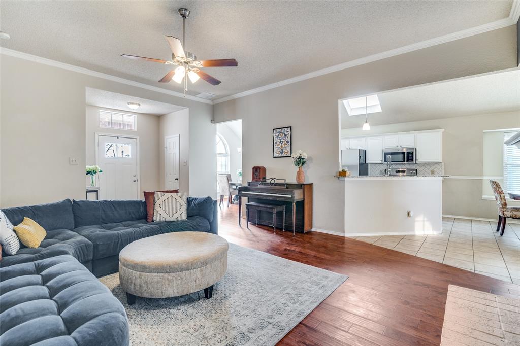 4201 Crystal Lane Garland, TX 75043 - Photo 10 of 33 a living room with furniture and a wooden floor