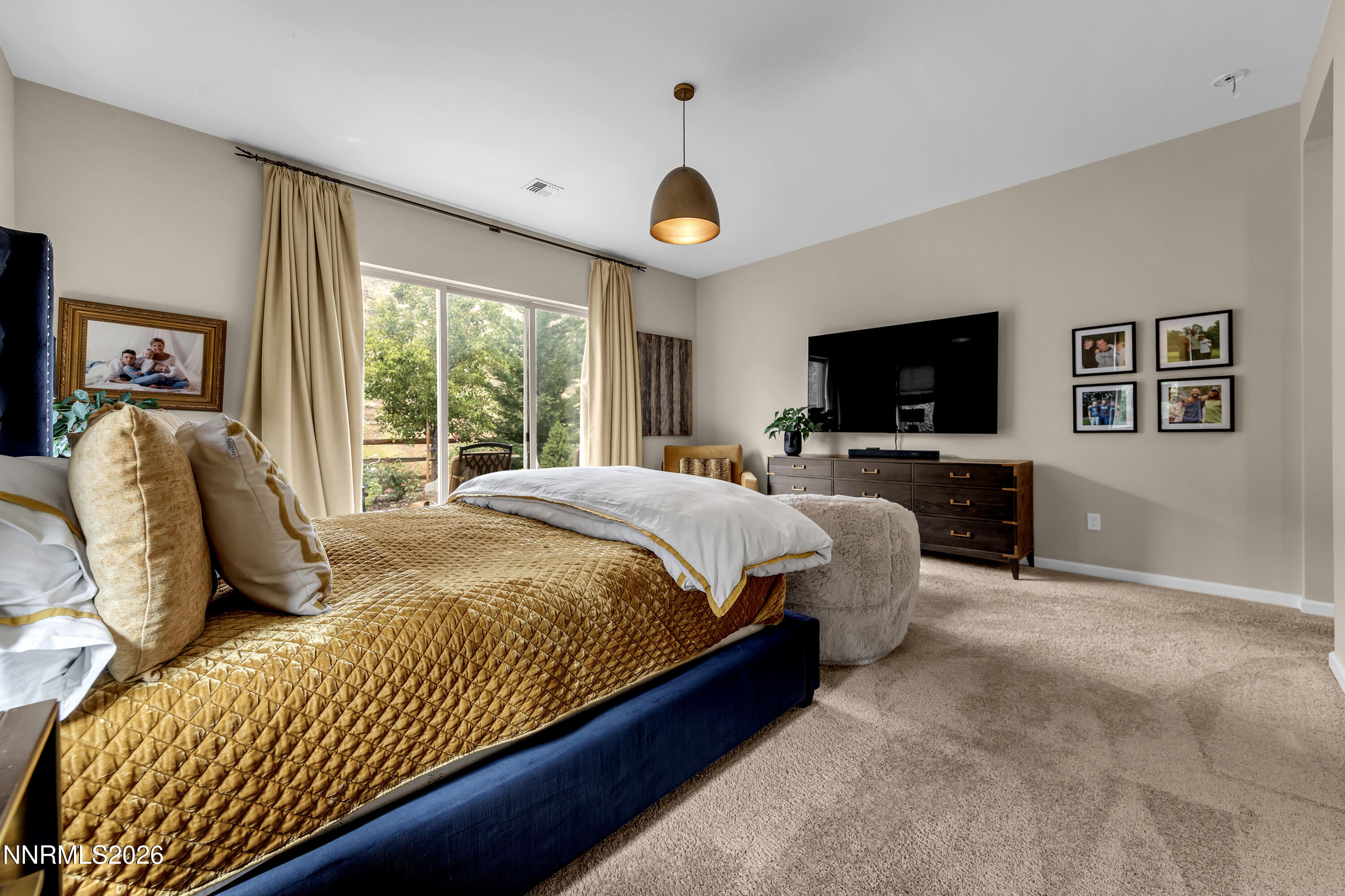 9021 Iron Sky Court Reno, NV 89523 - Photo 24 of 39 a bedroom with a bed window and a flat screen television