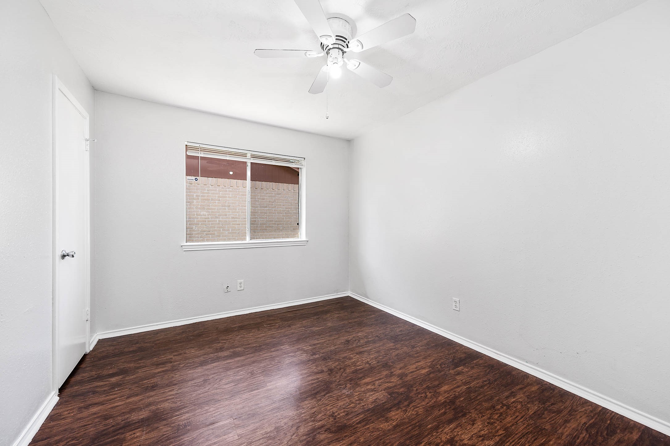 3423 Nutwood Lane Spring, TX 77389 - Photo 13 of 20 an empty room with a window and wooden floor