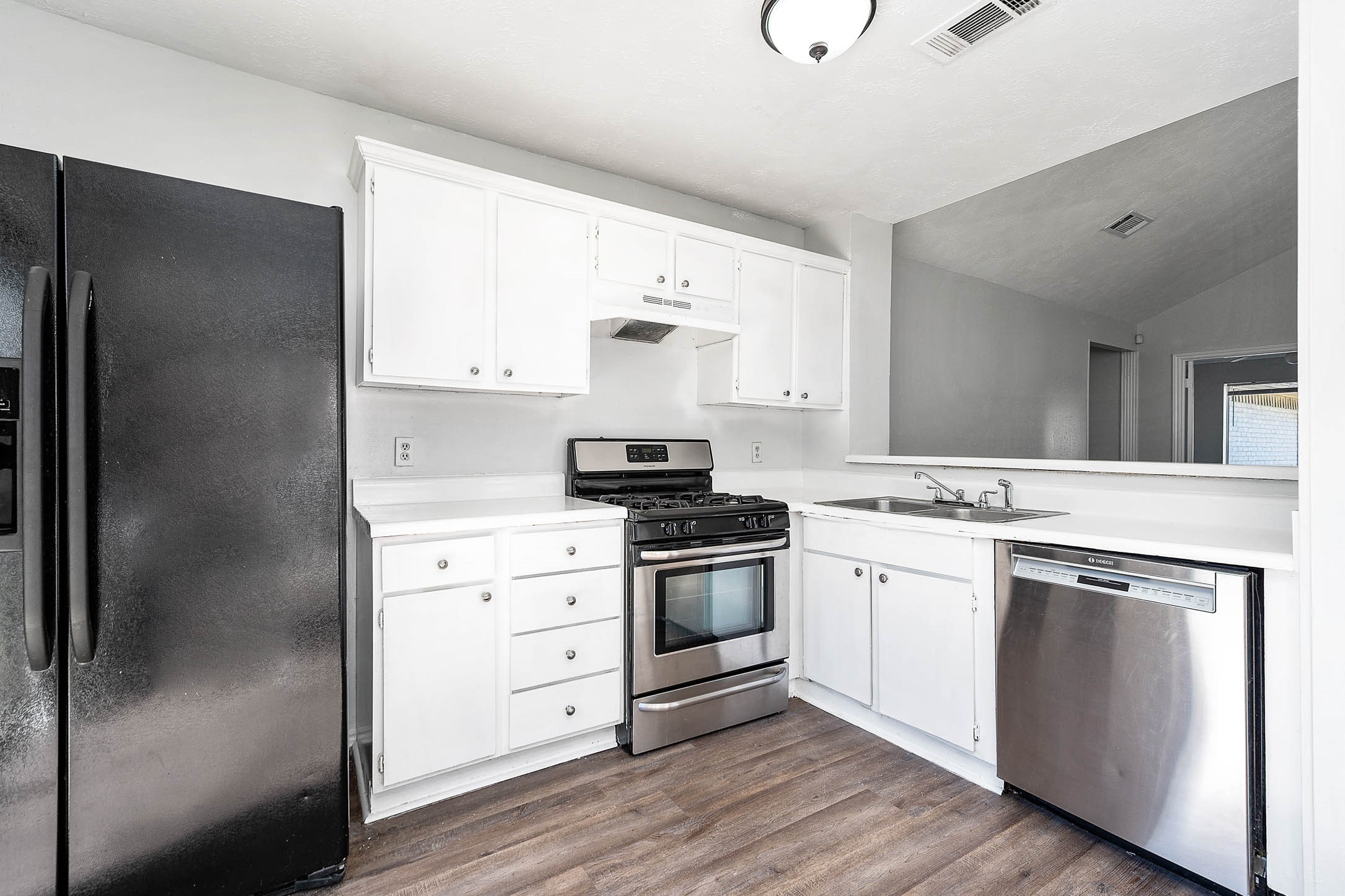3423 Nutwood Lane Spring, TX 77389 - Photo 10 of 20 a kitchen with a stove cabinets and wooden floor