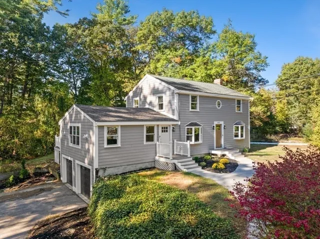 a front view of a house with yard