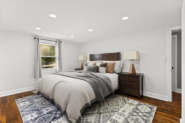 a bed room with two beds and a window