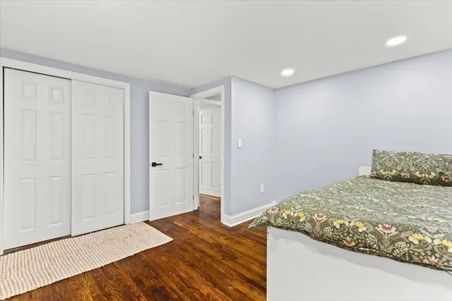 a bedroom with a bed and a shower