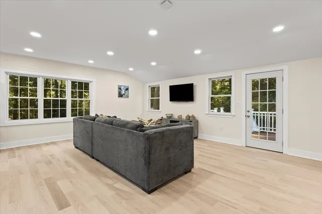 a living room with furniture and windows